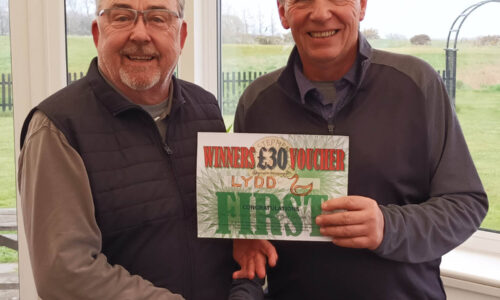 Ian Horsham (L) receives the winners voucher from skipper Pat Dawkins